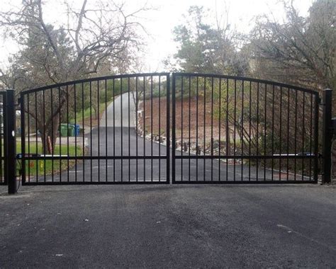 Top 10 iron and aluminum fence installation questions. Custom Automatic Wrought Iron Swing Arched Driveway Gate ...