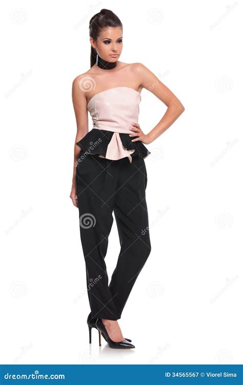 Young Woman With Hand On Hip Is Posing Royalty Free Stock Photography