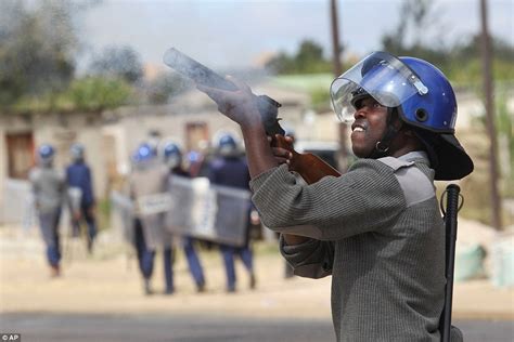 Taxi Driver In Zimbabwe Surrounded By Riot Cops And Beaten On The Floor