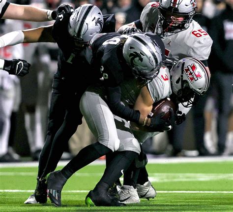 Photos: Truck stick! Denton Guyer QB Jackson Arnold pushes through a