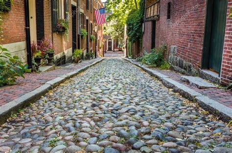 Cobbled Street Lined With Old Brick Buildings Stock Photo By ©alpegor6
