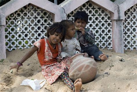 Three Poor Slum Children Playing On Sand Stock Editorial Photo