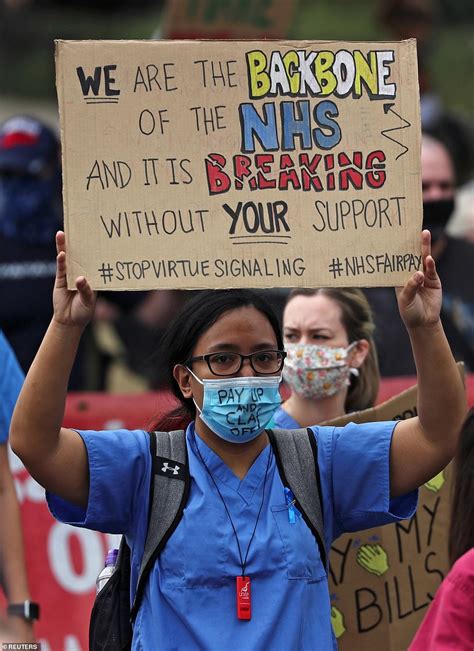 hundreds of nhs nurses and healthcare staff march through london in protest over pay