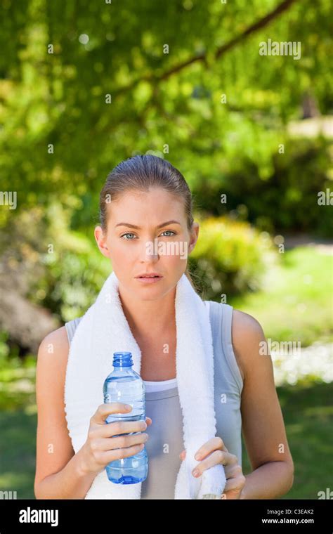 Woman Drinking Water After The Gym Stock Photo Alamy
