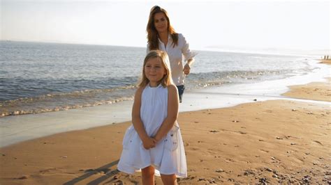 Mother Cuddling Daughter On Beach Stock Video Footage 0010 Sbv