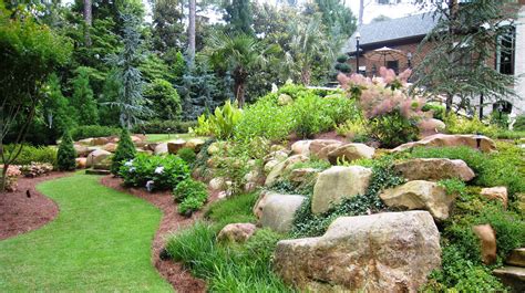 We have a terrific selection of large specimen fieldstone boulders in an endless array of shapes and sizes. Hillside Landscaping With Boulders | Landscaping berm ...