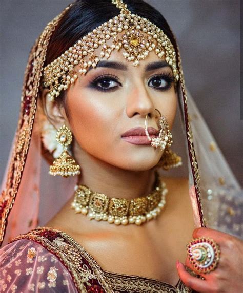 Indian Bridal Makeup And Jewellery Bridal Nose Ring Indian Bridal Indian Wedding Sari