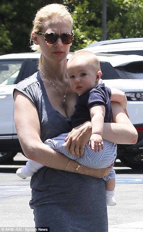 January Jones Goes For A Stroll With Son Xander In Clingy Low Cut Dress Daily Mail Online
