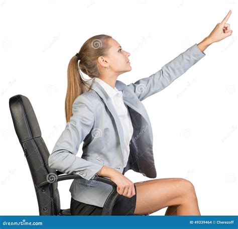Businesswoman On Office Chair Pointing Finger Up Stock Photo Image