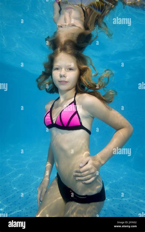 Beautiful Teen Girl Posing Under Water In The Pool Stock Photo Alamy