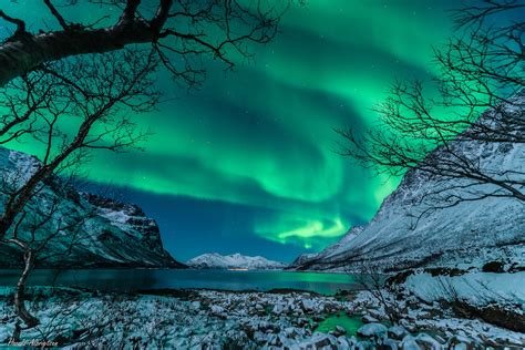 Green And Ghostly Northern Lights Haunt Norway Mountains Photo Space