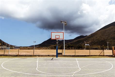 Basketball courts come in a range of sizes. Photo of Basketball Court Under Cloudy Sky · Free Stock Photo
