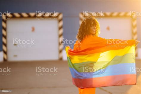 Beautiful African American Lesbian Woman With Lgbt Rainbow Flag At