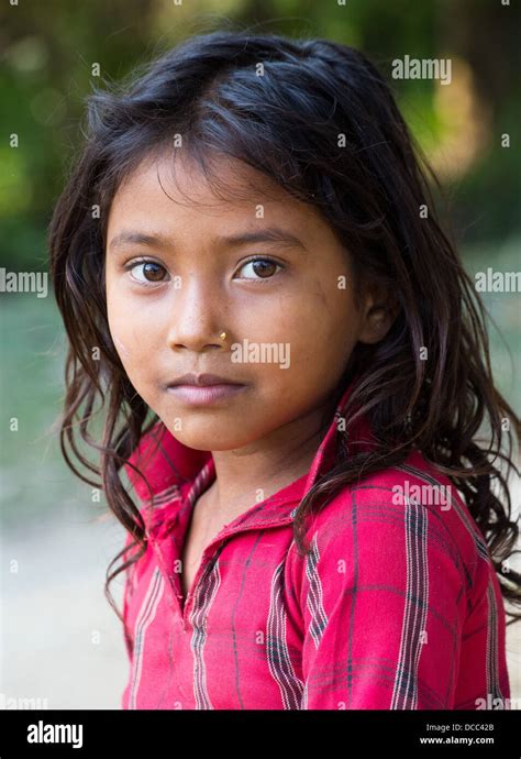 Beautiful Young Tharu Girl Wearing A Traditional Cotton Shirt In The