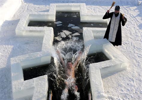 Orthodox Believers Take An Icy Plunge On Epiphany
