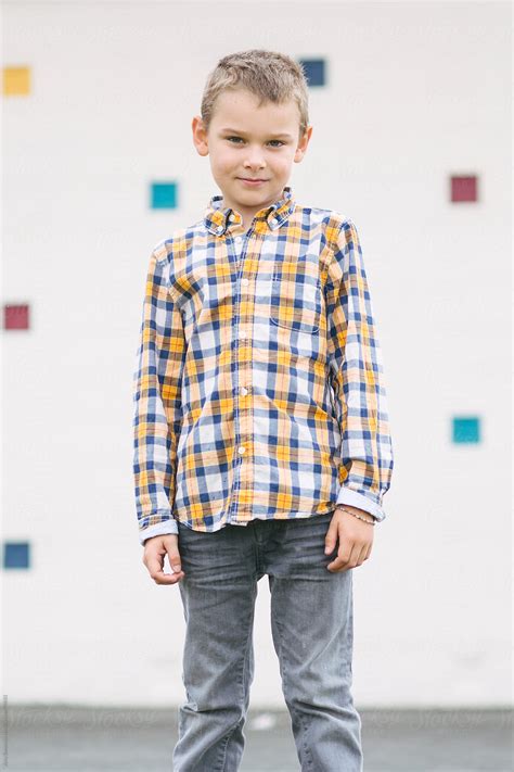 A Portrait Of A Young Boy In A Plaid Shirt By Stocksy Contributor A