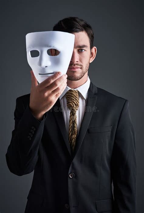 The Mask Can Be Misleading Studio Portrait Of A Young Businessman