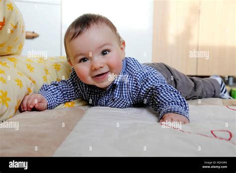 Young Boy Laying On Stomach High Resolution Stock Photography And