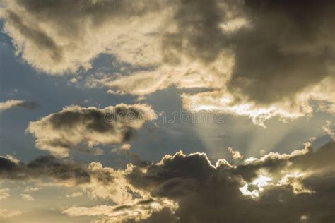 Beautiful Detail Of A Dramatic Sky In Which The Sun Peeks Through The
