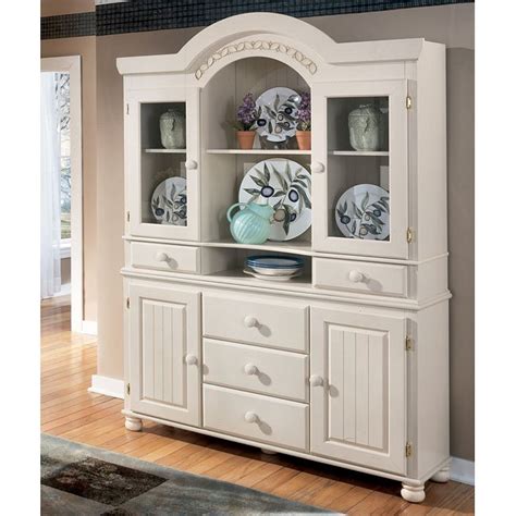 Three cabinets and an expansive surface serve your entertaining needs exceptionally well. Cottage Retreat Buffet with Hutch Signature Design by ...
