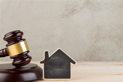 Real Estate Concept Auction Gavel And Little House With Copy Space