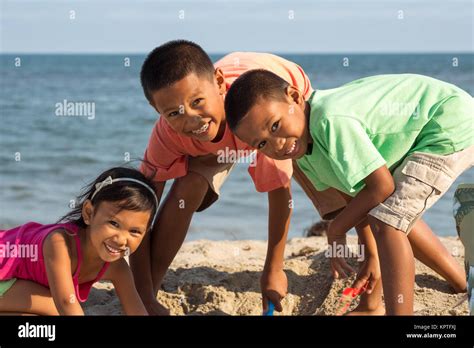 Happy Kids Playing On The Beach Stock Photo Alamy