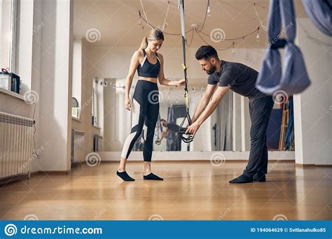 Trainer Instructing A Young Lady Before Workout Stock Image Image Of