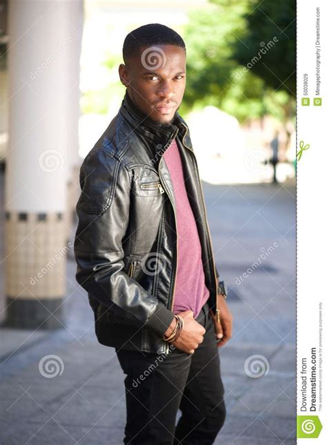 Black Male Fashion Model Posing In Leather Jacket Stock