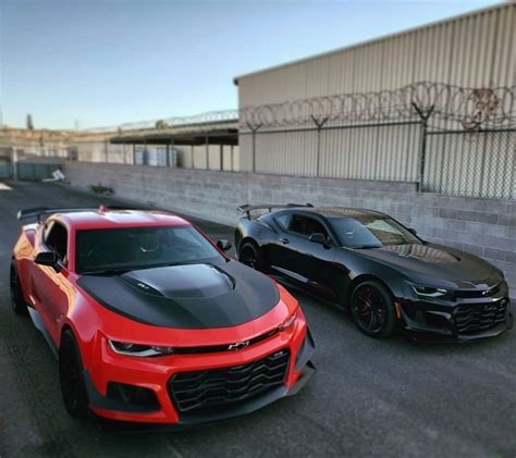 Two Chevrolet Camaro Zl1 1les Painted In Red Hot And Black Photo Taken