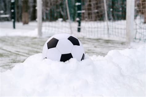 Premium Photo Football Ball Near Soccer Goal In Winter