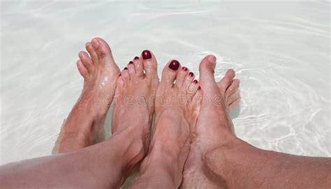 four feet of husband and wife in the pool during their honeymoo stock image image of passion