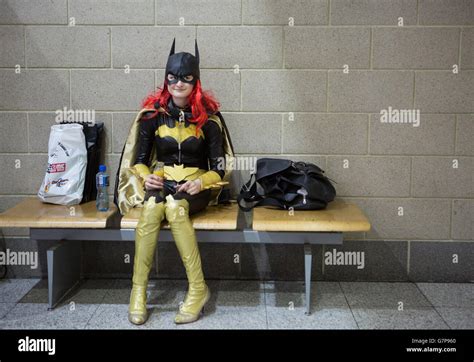 a comic fan dressed as bat woman at the london super comic convention at excel london stock
