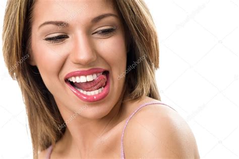 Sensual Woman Biting Tongue Stock Photo Luckybusiness