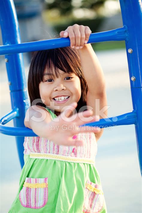 Cute Girl Waving Hello At The Park Stock Photos