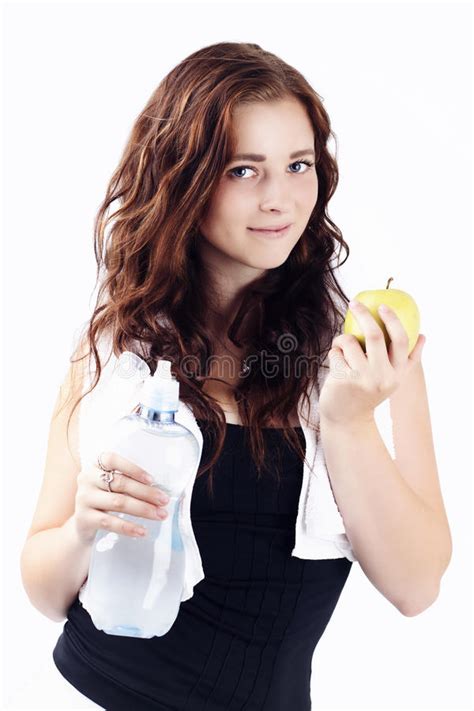 Beautiful Sporty Woman Drinking Watter And Eating Apple Stock Image