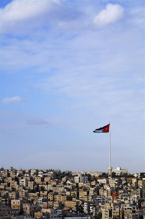 Jordanian Flag Flying Over The City Of Amman Jordan Photograph By
