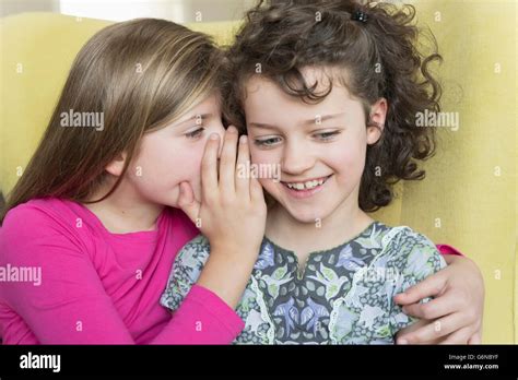 Two Girls Whispering Stock Photo Alamy