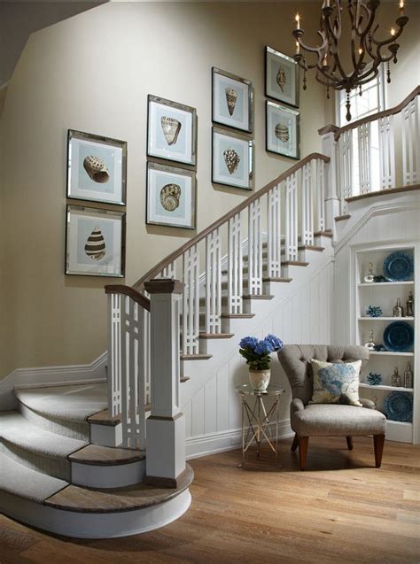 Here's a way to plan a display of framed pictures without making a single needless nail hole. :: Decor That Compliments The Stairway :: | Tuvalu Home