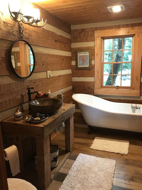 Discover the best small bathroom designs that will brighten up if you're designing your tiny bathroom from scratch (or remodeling), consider a tiny corner sink. #LogHome #Bathroom with handmade vanity & claw foot tub ...