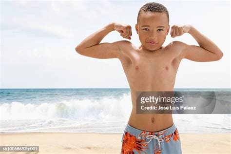 Boy Flexing Muscle Photos And Premium High Res Pictures Getty Images