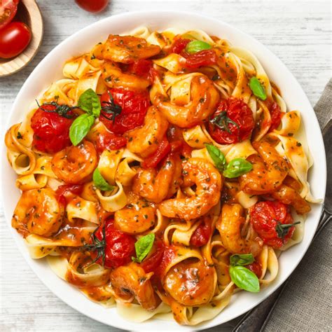 Italian Prawn Tomato Tagliatelle Recipe | myfoodbook | Creamy prawn ...