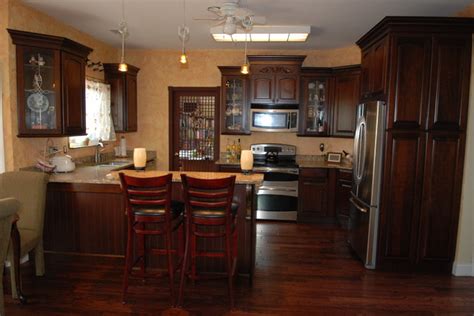 Cherry kitchen cabinets have been a staple in traditional kitchen designs and styles for nearly hundreds of years. KraftMaid Montclair Cherry Arch In Cabernet Finish ...