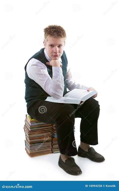 The Schoolboy Sits On A Pack Of Books Stock Photo Image Of Learning