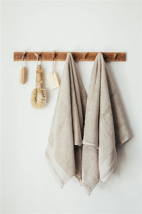 Wooden Hanger With Towels And Natural Bathroom Tools · Free Stock Photo