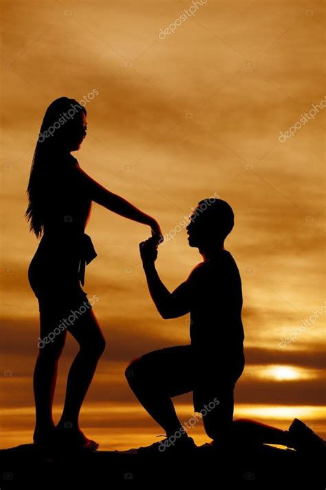 Maybe you would like to learn more about one of these? Man propose to woman silhouette — Stock Photo ...