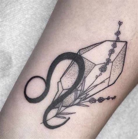 A Black And White Photo Of A Tattoo Design On The Arm That Has An