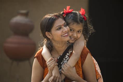 portrait of loving indian mother and daughter at village stock image image of person people