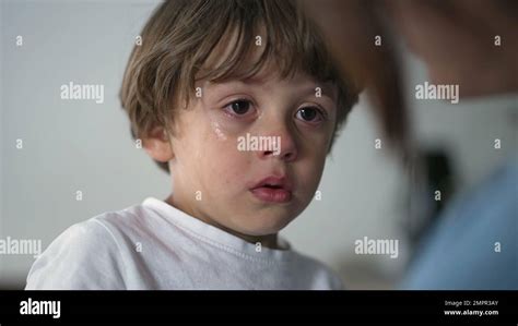 Portrait Of A Tearful Child Crying Closeup Face Of A Sad Little Boy