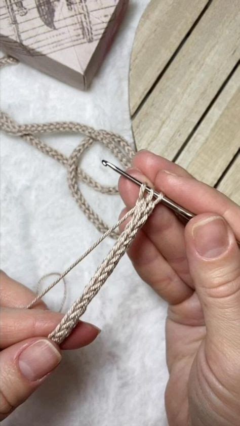 Two Hands Are Working On A Piece Of String