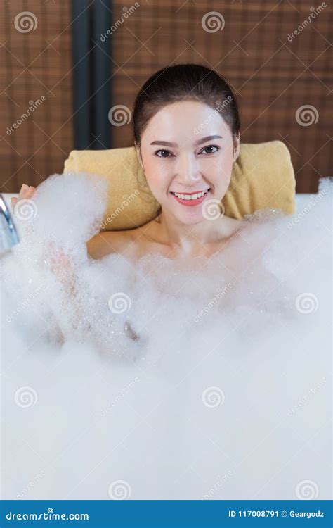 Woman Takes Bubble Bath And Playing In Bathtub Stock Image Image Of Bubble Asian 117008791